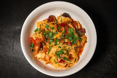 Pappardelle with Rose Harissa, Black Olives, and Capers